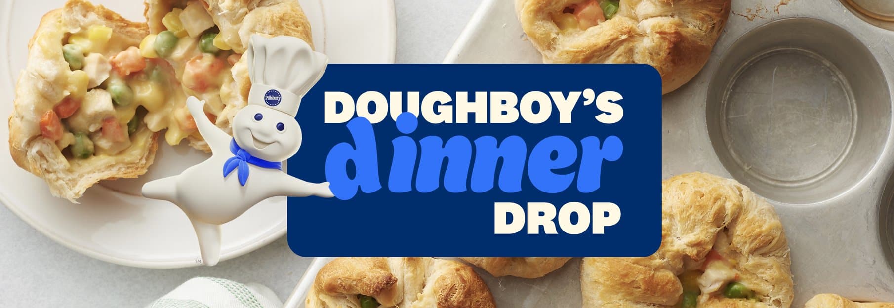 Mini pot pies in a muffin tin, with golden brown, flaky pastry, showcasing a creamy vegetable filling.