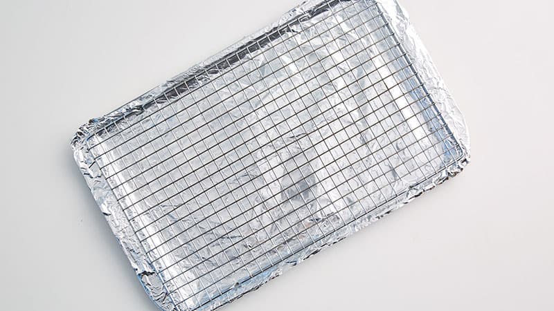 Baking rack on top of a foil-lined-baking sheet